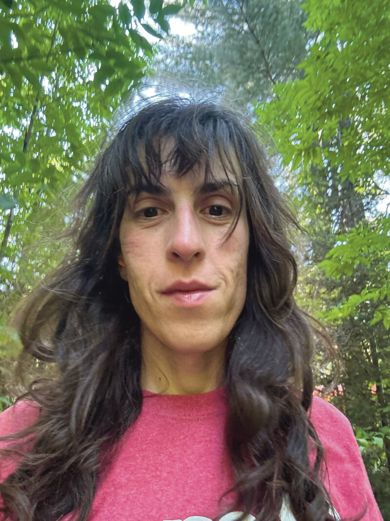 My hair is messy, and I am wearing a red gym tshirt.