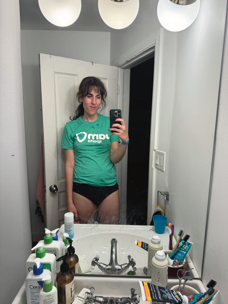 Bathroom selfie. I'm wearing a green gym tshirt and underwear. I look rather pleased with myself.